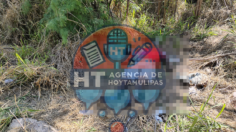 Cad�ver en terreno bald�o